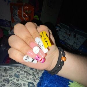 Colorful Nail Art Set with Pink and Yellow Designs